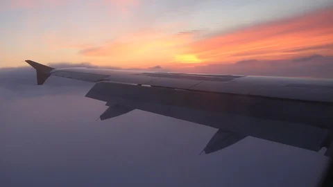 Plane flying over clouds on sunrise background Vidéo 111926482