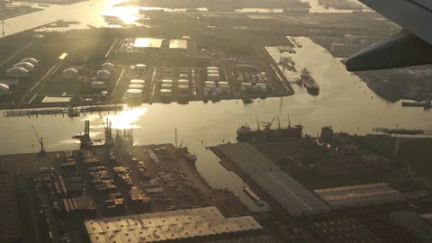 Plane flying over the fields of Amsterdam Stock Footage 92762397