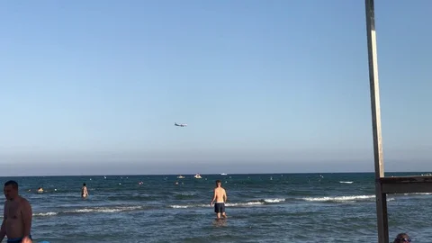 Plane Flying over Finikoudes beach in Larnaca Stock-Footage 89730860