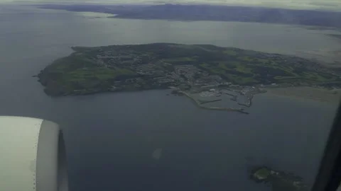 Plane flying over island. Stock Footage 133574616