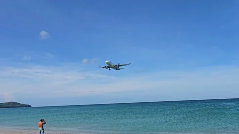 Plane is flying over the ocean Stock Footage 304321749