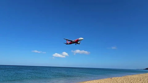 Plane is flying over the ocean Stock Footage 304323445