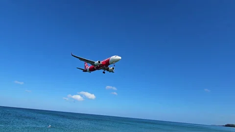 Plane is flying over the ocean Stock Footage 304323770