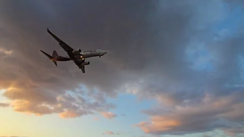 Plane is flying over the ocean Stock Footage 304324270