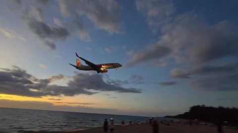 Plane is flying over the ocean Stock Footage 304325792