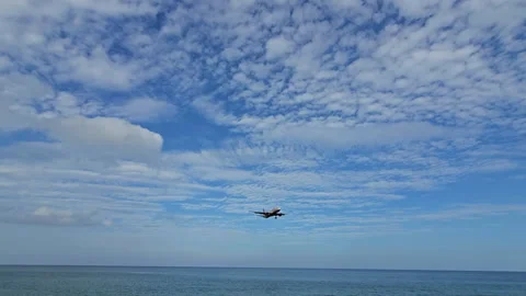Plane is flying over the ocean Stock Footage 304329023