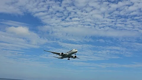 Plane is flying over the ocean Stock Footage 304330245