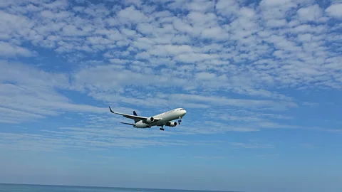 Plane is flying over the ocean Stock Footage 304331276