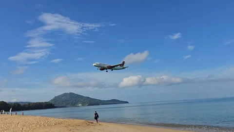 Plane is flying over the ocean Stock Footage 304409544