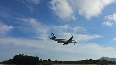 Plane is flying over the ocean Stock Footage 304409634