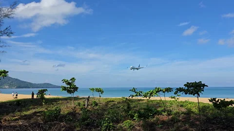 Plane is flying over the ocean Stock Footage 304410680