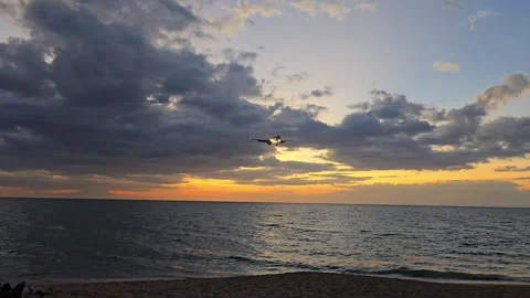 Plane is flying over the ocean Stock Footage 304414017