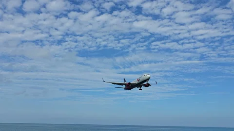 Plane is flying over the ocean Stock Footage 304416354