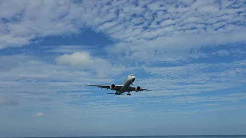 Plane is flying over the ocean Stock Footage 304417328