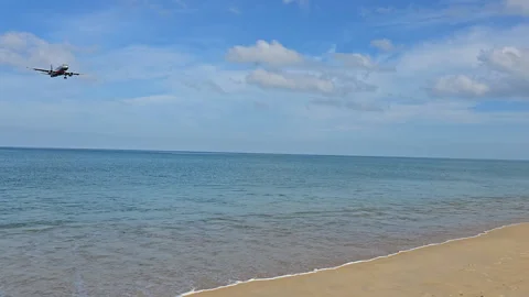 Plane is flying over the ocean Stock Footage 304425484