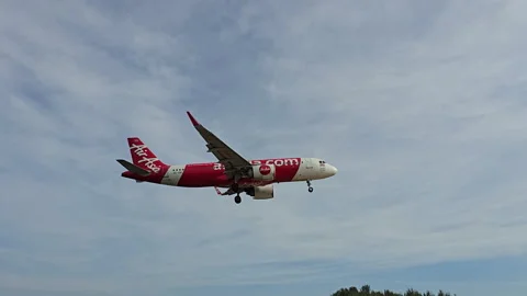 Plane is flying over the ocean Stock Footage 305033186