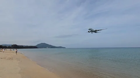 Plane is flying over the ocean Stock Footage 305033999