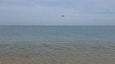 Plane is flying over the ocean Stock Footage 305035590