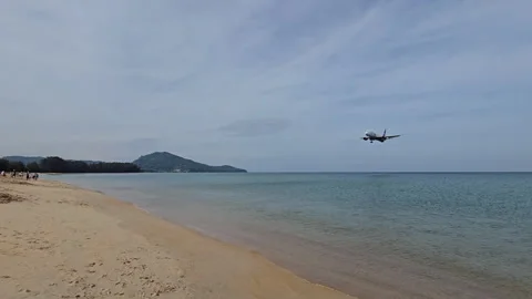 Plane is flying over the ocean Stock Footage 305036428