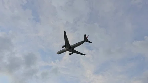 Plane is flying over the ocean Stock Footage 305040281