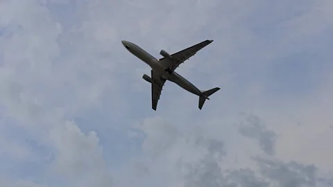 Plane is flying over the ocean Stock Footage 305040789