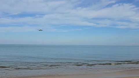 Plane is flying over the ocean Stock Footage 305045374