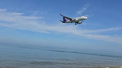 Plane is flying over the ocean Stock Footage 305049108