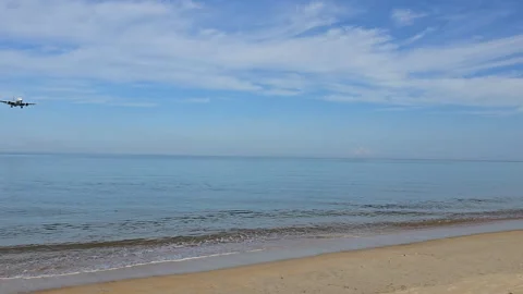 Plane is flying over the ocean Stock Footage 305049393