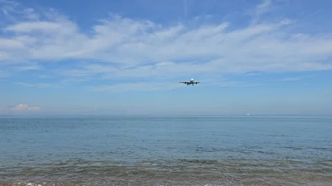 Plane is flying over the ocean Stock Footage 305050082