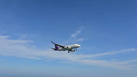 Plane is flying over the ocean Stock Footage 305050181