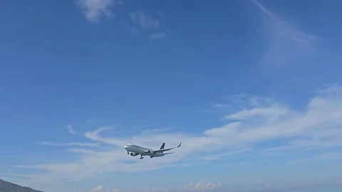 Plane is flying over the ocean Stock Footage 305051579