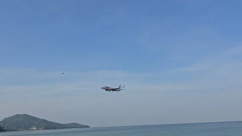 Plane is flying over the ocean Stock Footage 305052076