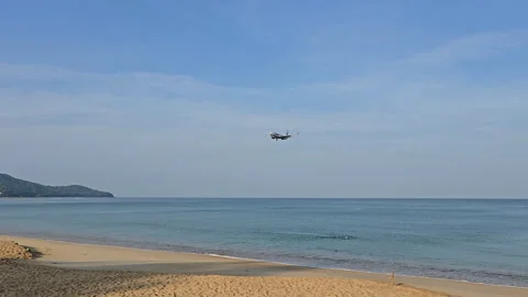 Plane is flying over the ocean Stock Footage 305052324