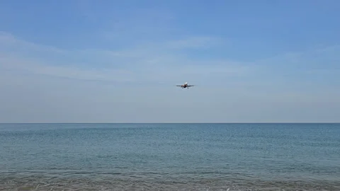 Plane is flying over the ocean Stock Footage 305053586