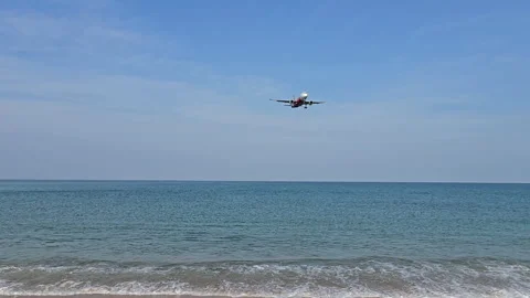 Plane is flying over the ocean Stock Footage 305054766