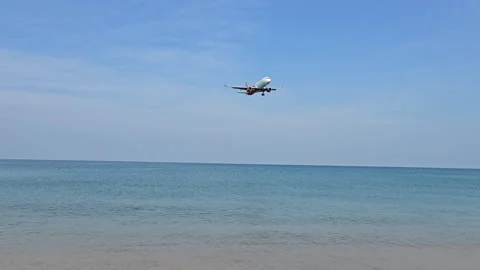 Plane is flying over the ocean Stock Footage 305057473