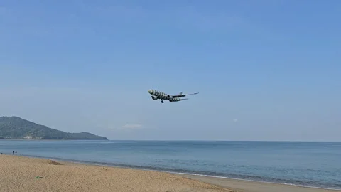 Plane is flying over the ocean Stock Footage 305059863