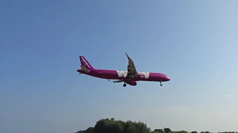 Plane is flying over the ocean Stock Footage 305062150