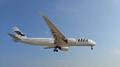 Plane is flying over the ocean Stock Footage 305063377