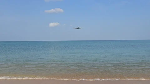 Plane is flying over the ocean Stock Footage 305063844