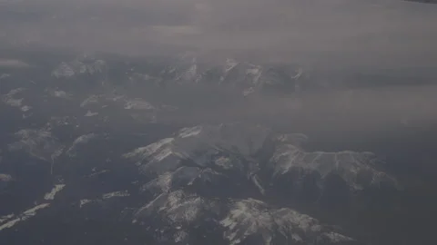 Plane Flying Over the Rocky Mountains Stock Footage 147699643