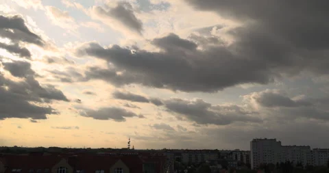 A plane flying over the sunlight breaking through clouds before sunset Stock Footage 252673102