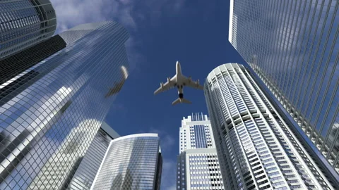 A plane flying over tall buildings Video stock 195012007