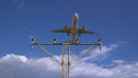 Plane Flying Overhead With Clouds In The Background Stock Footage 125469788