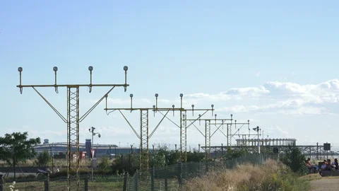 A plane flying overhead as it comes into land at Barcelona - El Prat Airport Stock Footage 121953656