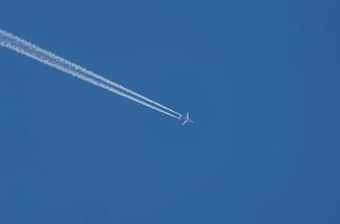 Plane flying in the sky Stock Photos