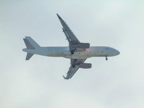A plane is flying in the sky Stockfoto's