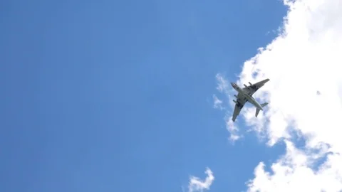 The plane is flying in the sky. The plane is high in the clouds. Video stock 76690725