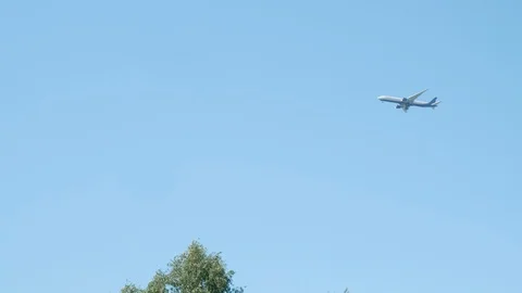 Plane is flying in sky relieving altitude before landing. Bottom view. Stock Footage 119253993