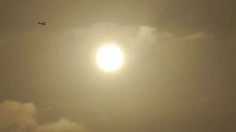 Plane flying by the sun HD Stock Footage 5454348